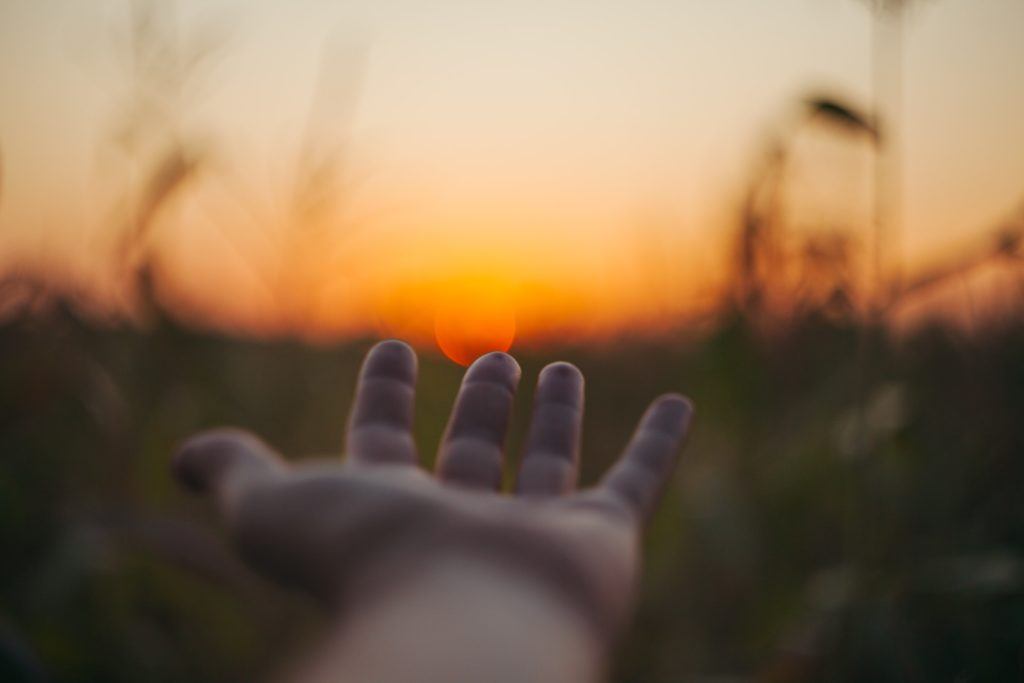 reaching out to sunset